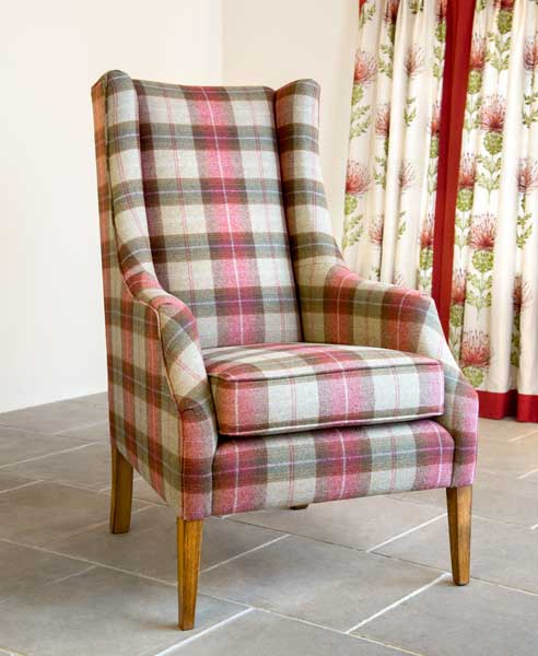 High backed, wing chair, red tartan fabric.