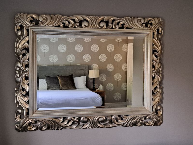 Mirror on bedroom wall